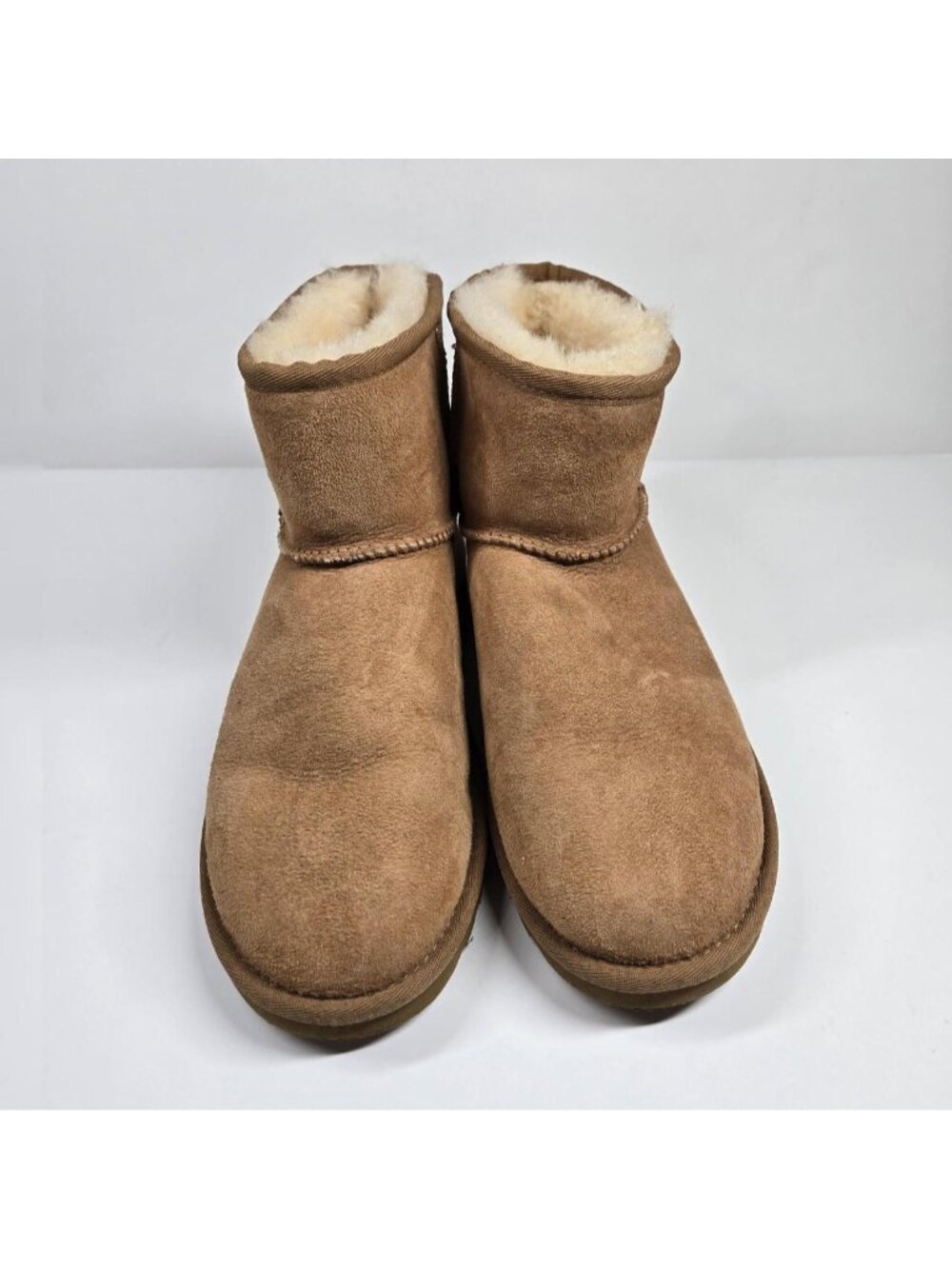 UGG Classic Mini Shearling winter Boots. chestnut brown suede uppers.